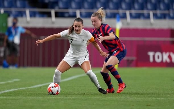 Ali Riley of Team New Zealand attempts to move past Emily Sonnett of the Team United States during a game between New Zealand and USWNT at Saitama...