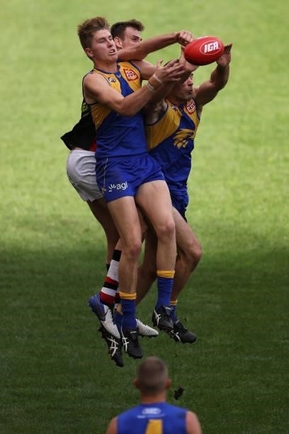 Harry Edwards and Shannon Hurn of the Eagles contest for a mark against Paul Hunter of the Saints during the round 19 AFL match between West Coast...