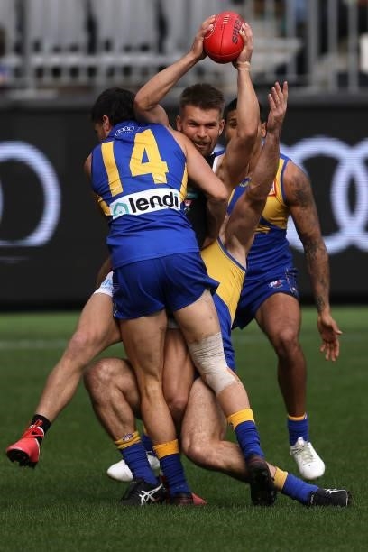 Dan Butler of the Saints gets tackled by Liam Duggan of the Eagles during the round 19 AFL match between West Coast Eagles and St Kilda Saints at...