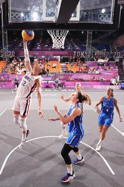 Laetitia Guapo of Team France drives to the basket during the Women's Pool Round match between France and Italy on day one of the Tokyo 2020 Olympic...