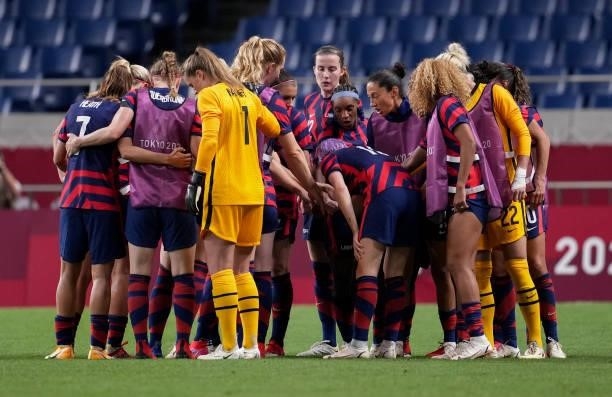 The United States huddle up before the start of the second half during a game between New Zealand and USWNT at Saitama Stadium on July 24, 2021 in...