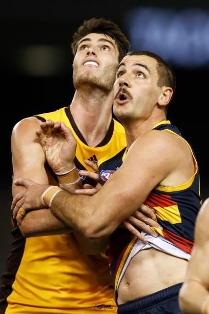Taylor Walker of the Crows and Ned Reeves of the Hawks contest the ruck during the round 20 AFL match between Adelaide Crows and Hawthorn Hawks at...