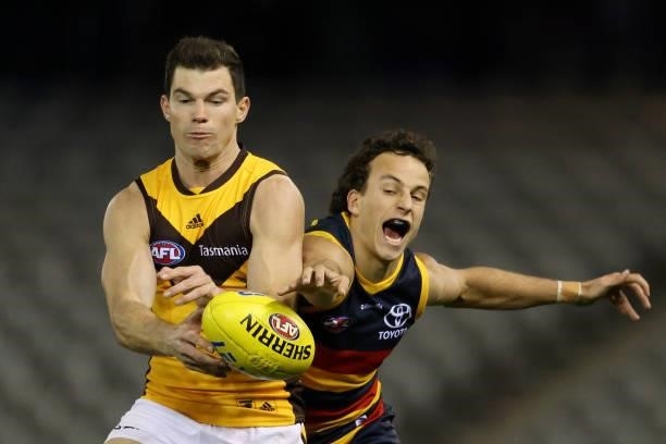 Jaeger O'Meara of the Hawks and Will Hamill of the Crows contest for the ball during the round 20 AFL match between Adelaide Crows and Hawthorn Hawks...