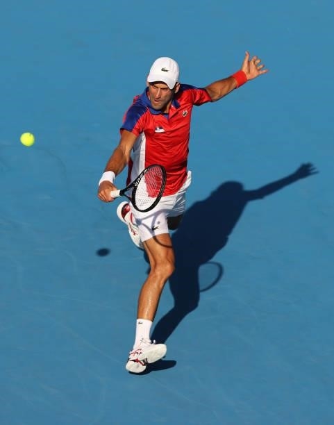 Novak Djokovic of Team Serbia plays a backhand during his Men's Singles First Round match against Hugo Dellien of Team Bolivia on day one of the...