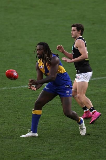 Nic Naitanui of the Eagles handballs during the round 19 AFL match between West Coast Eagles and St Kilda Saints at Optus Stadium on July 24, 2021 in...