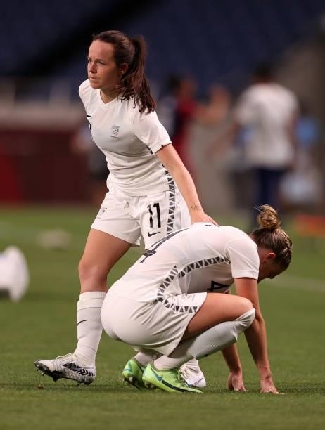 Bott of Team New Zealand is consoled by team mate Olivia Chance following defeat in the Women's First Round Group G match between New Zealand and...