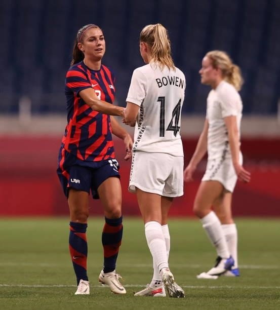 Alex Morgan of Team United States shakes hands with Katie Bowen of Team New Zealand following the Women's First Round Group G match between New...