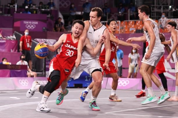 Keisei Tominaga of Team Japan drives to the basket for the win in overtime during the Men's Pool Round match between Belgium and Japan on day one of...