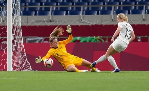 Alyssa Naeher GK of USA attempts to save a ball from Paige Satchell of New Zealand during a game between New Zealand and USWNT at Saitama Stadium on...