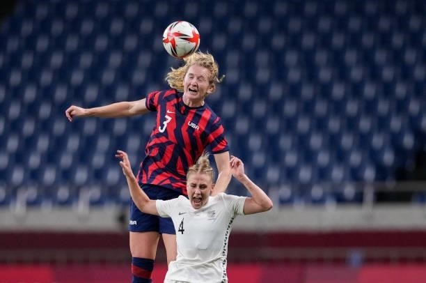 Samantha Mewis of the United States and CJ Bott of New Zealand battle in the air for a ball during a game between New Zealand and USWNT at Saitama...
