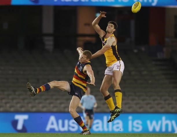 Ned Reeves of the Hawks wins a tap out during the round 20 AFL match between Adelaide Crows and Hawthorn Hawks at Marvel Stadium on July 24, 2021 in...