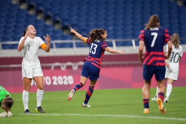Alex Morgan of the United States scores and celebrates during a game between New Zealand and USWNT at Saitama Stadium on July 24, 2021 in Saitama,...