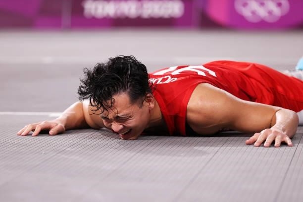 Tomoya Ochiai of Team Japan is fouled during the Men's Pool Round match between Belgium and Japan on day one of the Tokyo 2020 Olympic Games at Aomi...