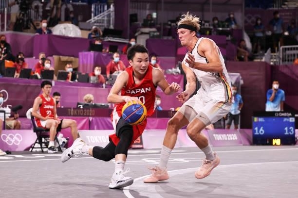 Keisei Tominaga of Team Japan controls the ball during the Men's Pool Round match between Belgium and Japan on day one of the Tokyo 2020 Olympic...