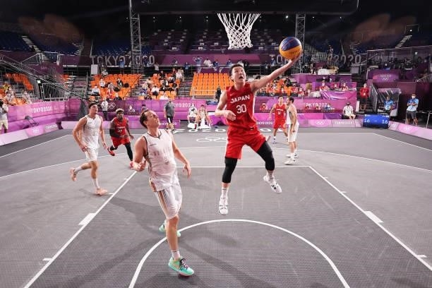 Keisei Tominaga of Team Japan drives to the basket during the Men's Pool Round match between Belgium and Japan on day one of the Tokyo 2020 Olympic...