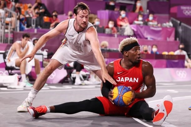 Ira Brown of Team Japan is challenged by Thierry Marien of Team Belgium during the Men's Pool Round match between Belgium and Japan on day one of the...