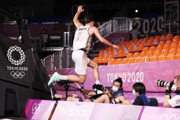 Rafael Bogaerts of Team Belgium jumps into the photographers area during the Men's Pool Round match between Belgium and Japan on day one of the Tokyo...