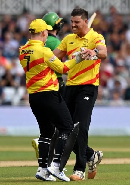Marchant de Lange of Trent Rockets Men celebrates with team mate Tom Moores after taking his fifth wicket during The Hundred match between Trent...