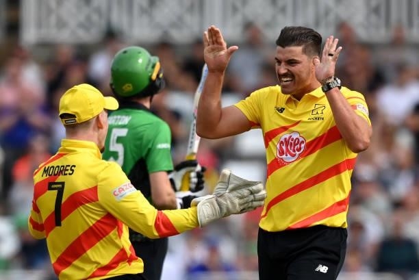 Marchant de Lange of Trent Rockets Men celebrates with team mate Tom Moores after taking his fifth wicket during The Hundred match between Trent...