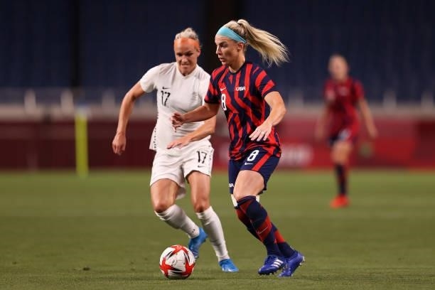 Julie Ertz of Team United States in possession whilst under pressure from Hannah Wilkinson of Team New Zealand during the Women's First Round Group G...