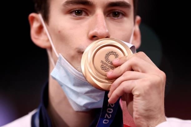Bronze medalist Mikhail Artamonov of Team ROC poses with the bronze medal for the Men's -58kg Taekwondo Gold Medal on day one of the Tokyo 2020...