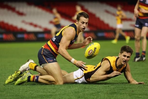 Tom Doedee of the Crows and Daniel Howe of the Hawks contest for the ball during the round 20 AFL match between Adelaide Crows and Hawthorn Hawks at...