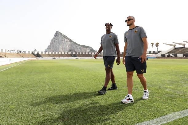 Willy Boly and Romain Saiss of Wolverhampton Wanderers walk on during a pitch inspection in front of the Rock of Gibraltar prior to the Pre-Season...