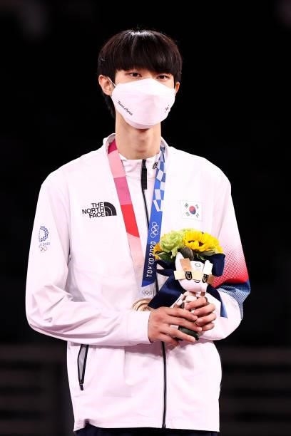 Bronze medalist Jang Jun of Team South Korea poses with the bronze medal for the Men's -58kg Taekwondo Gold Medal on day one of the Tokyo 2020...