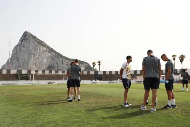Raul Jimenez of Wolverhampton Wanderers speaks with his teammates during a pitch inspection in front of the Rock of Gibraltar prior to the Pre-Season...