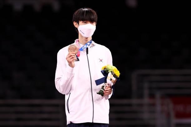 Bronze medalist Jang Jun of Team South Korea poses with the bronze medal for the Men's -58kg Taekwondo Gold Medal on day one of the Tokyo 2020...