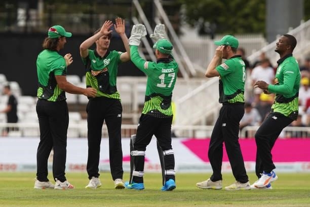 George Garton of Southern Brave celebrates with his teammates after dismissing Alex Hales of Trent Rockets during The Hundred game between Trent...