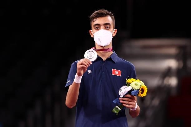 Silver medalist Mohamed Khalil Jendoubi of Team Tunisia poses with the silver medal for the Men's -58kg Taekwondo Gold Medal on day one of the Tokyo...