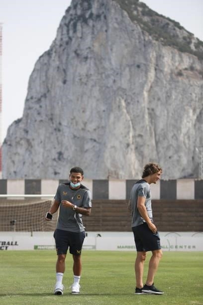 Morgan Gibbs-White and Fabio Silva of Wolverhampton Wanderers react during a pitch inspection in front the Rock of Gibraltar prior to the Pre-Season...