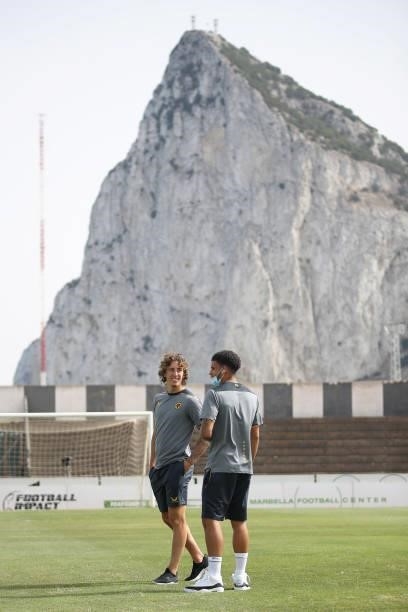 Morgan Gibbs-White and Fabio Silva of Wolverhampton Wanderers speak during a pitch inspection in front the Rock of Gibraltar prior to the Pre-Season...