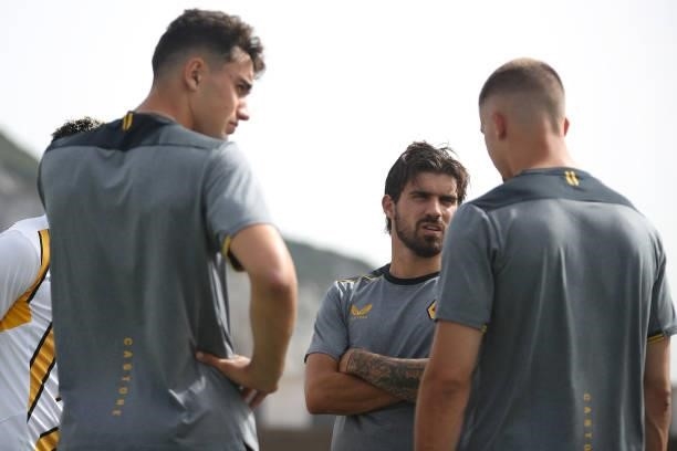 Ruben Neves of Wolverhampton Wanderers speaks with teammates during a pitch inspection prior to the Pre-Season Friendly match between Real Betis and...