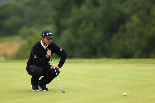 Masahiro Kawamura of Japan lines his putt up on the 15th hole during Day Three of the Cazoo Open supported by Gareth Bale at Celtic Manor Resort on...