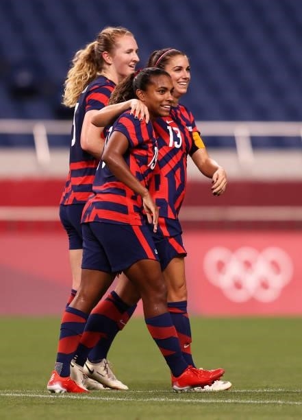 Alex Morgan of Team United States celebrates with Catarina Macario after scoring their side's fifth goal during the Women's First Round Group G match...