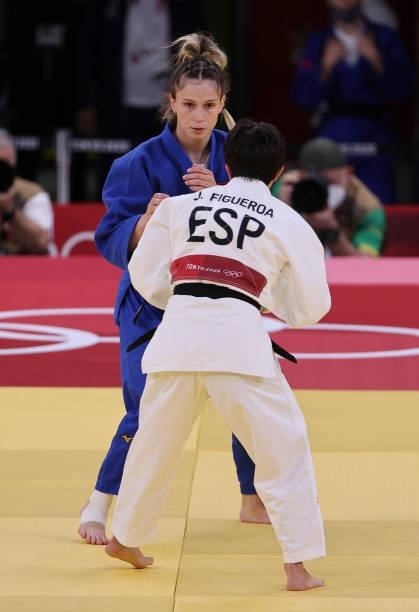 Julia Figueroa of Spain in white against Gulkader Senturk of Turkey in blue during day one of the Tokyo 2020 Olympic Games at Nippon Budokan on July...