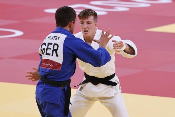 Jorre Verstraeten of Belgium in white against Moritz Plafky of Germany in blue during day one of the Tokyo 2020 Olympic Games at Nippon Budokan on...