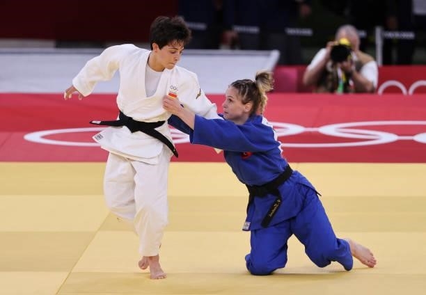 Julia Figueroa of Spain in white against Gulkader Senturk of Turkey in blue during day one of the Tokyo 2020 Olympic Games at Nippon Budokan on July...