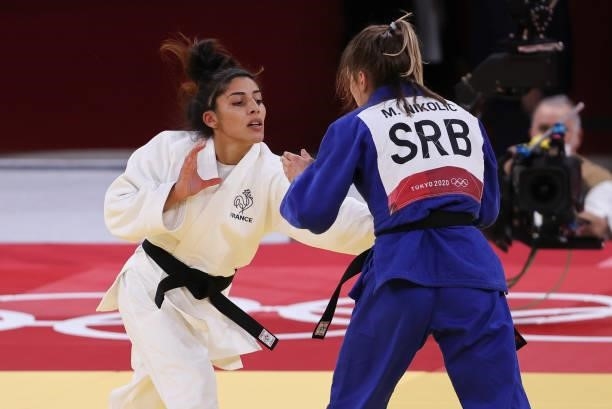 Shirine Boukli of France in white against Moritz Plafky of Germany in blue during day one of the Tokyo 2020 Olympic Games at Nippon Budokan on July...