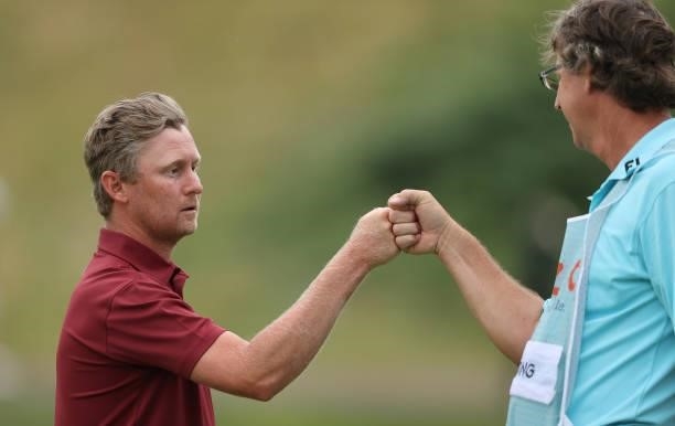 Justin Harding of South Africa fist pumps his caddie Alan Burns during the third round of the Cazoo Open supported by Gareth Bale at Celtic Manor...