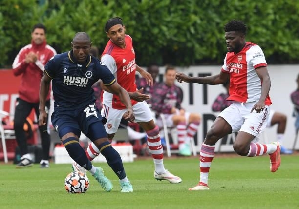 Benik Afobe of Millwall takes on Pierre-Emerick Aubameyang and Thomas Partey of Arsenal during the pre season friendly between Arsenal and Millwall...