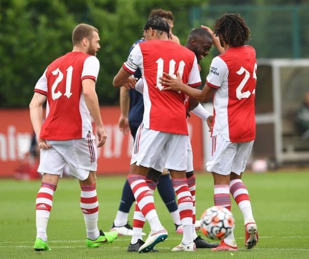 Nicolas Pepe is congratulated following an Arsenal goal by Mohamed Elneny and Pierre-Emerick Aubameyang during the pre season friendly between...