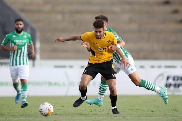 Rayan Ait-Nouri of Wolverhampton Wanderers is challenged by Alex Moreno of Real Betis during the Pre-Season Friendly match between Real Betis and...