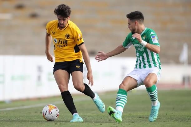 Francisco Trincao of Wolverhampton Wanderers is challenged by Alex Moreno of Real Betis during the Pre-Season Friendly match between Real Betis and...