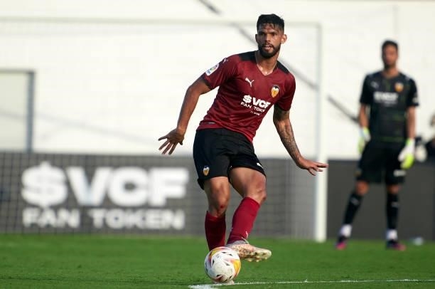 Omar Alderete of Valencia CF passes the ball during the pre-season friendly match between Valencia CF and FC Cartagena at Antonio Puchades Stadium on...