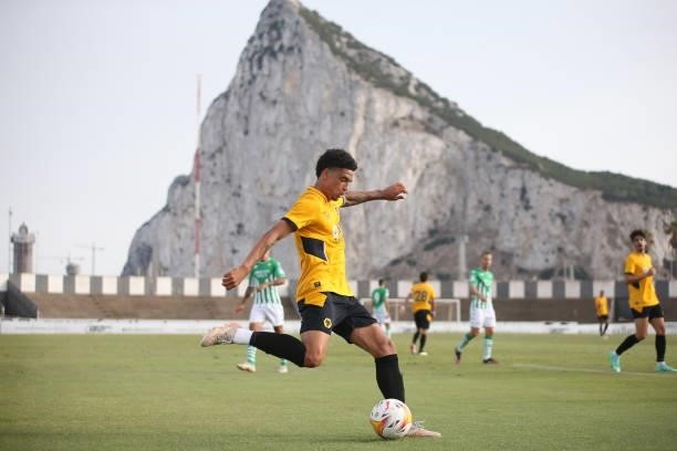Ki-Jana Hoever of Wolverhampton Wanderers crosses the ball in front of the Rock of Gibraltar during the Pre-Season Friendly match between Real Betis...