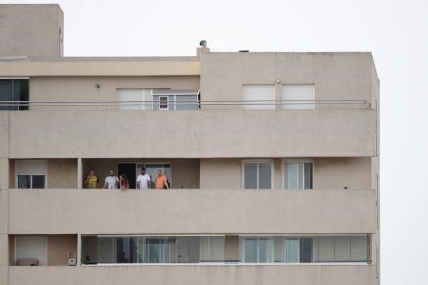 Spectators watch from a nearby balcony during the Pre-Season Friendly match between Real Betis and Wolverhampton Wanderers at Estadio Municipal de La...