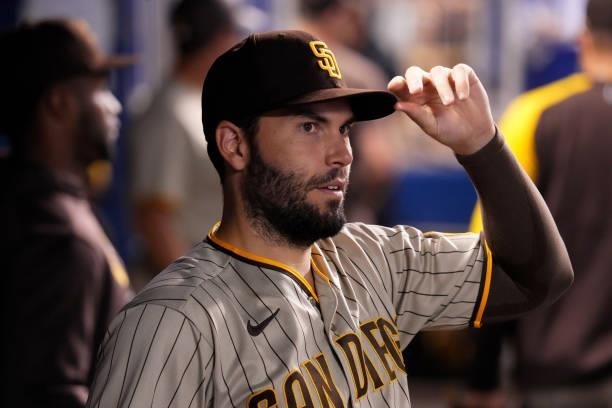 Eric Hosmer of the San Diego Padres looks on from the dugout during the game against the Miami Marlins at loanDepot park on July 23, 2021 in Miami,...
